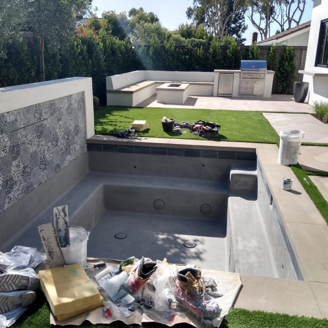 Need Just A Spa With Fire Pit, Bench, And BBQ Island? We Can Help6